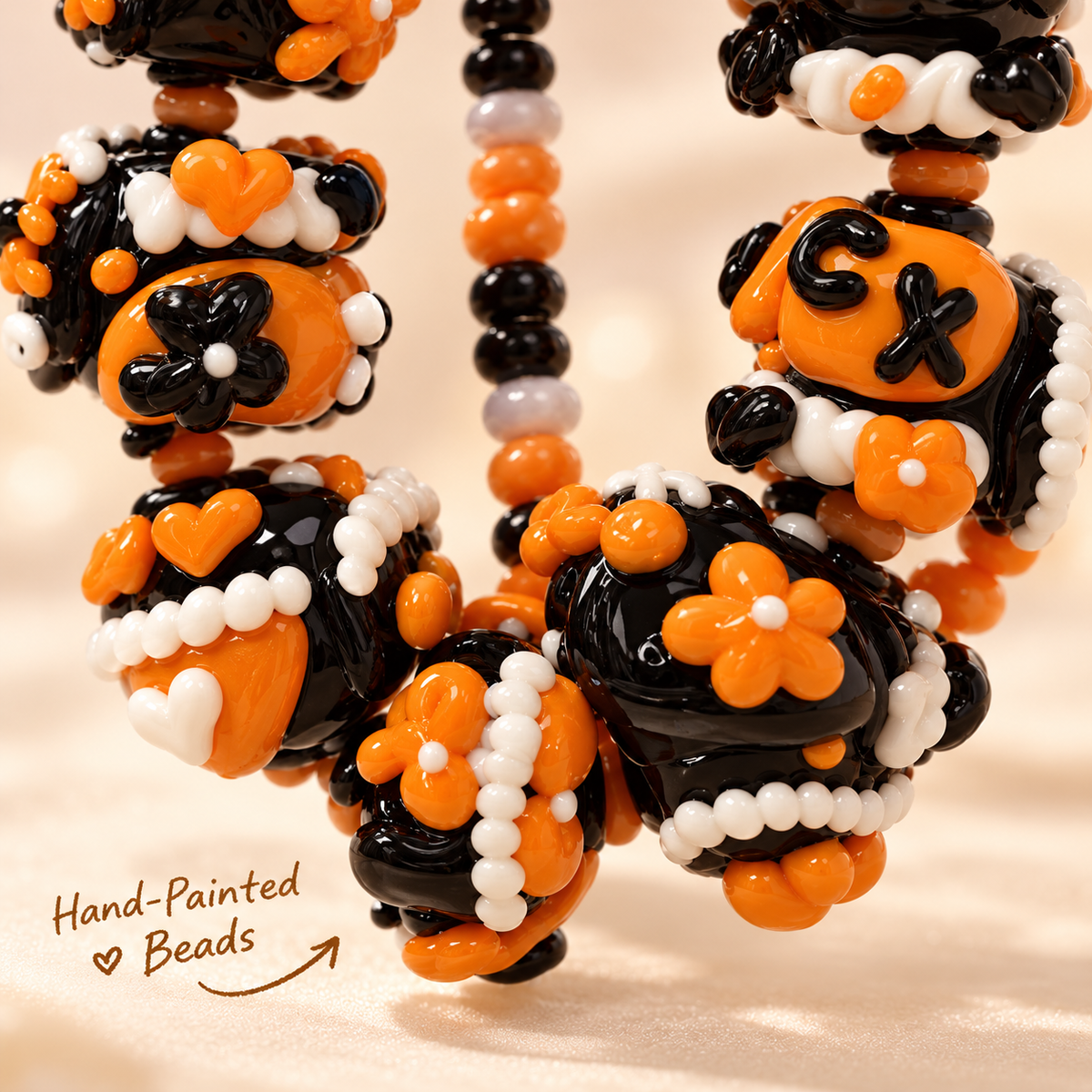Macro details of black orange white hand-painted chunky beads